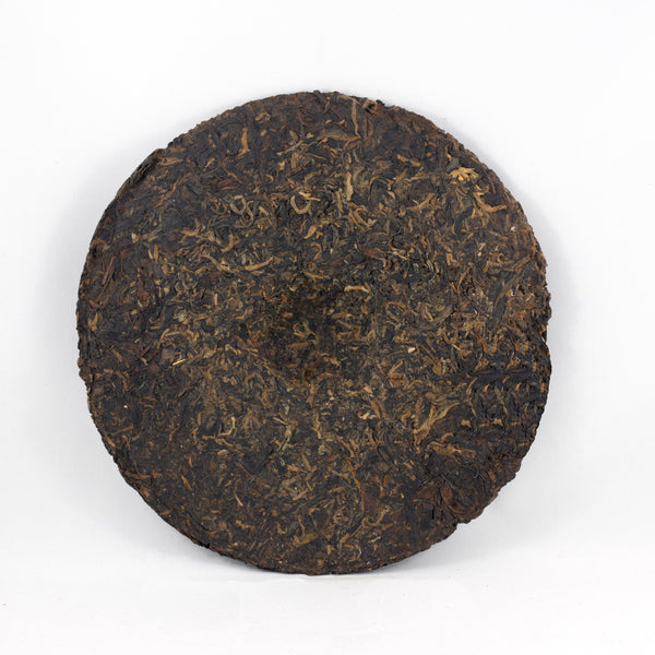 Pu-Erh Tea Cake, "Iron Mold", Import/Export Corporation, 1990s (Raw/Sheng)