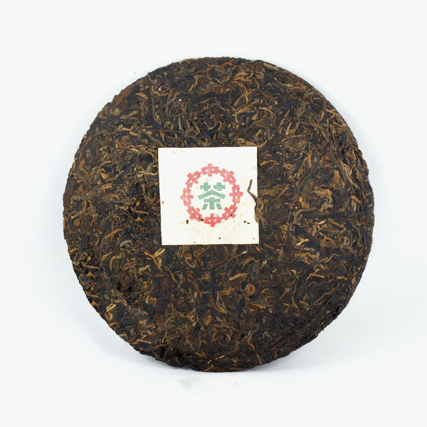 Pu-Erh Tea Cake, "Iron Mold", Import/Export Corporation, 1990s (Raw/Sheng)